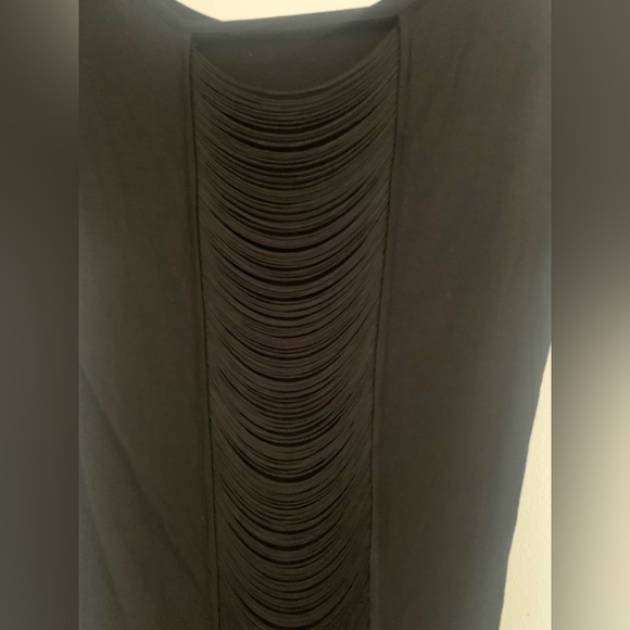 Short sleeve top with drapery right down fringes on the back of the shirt. - Picture 2 of 4